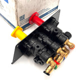 Rear isometric view of the 801631 valve assembly, showcasing the brass push-to-connect fittings and molded port identifiers like TRAC DEL and TRL DEL.