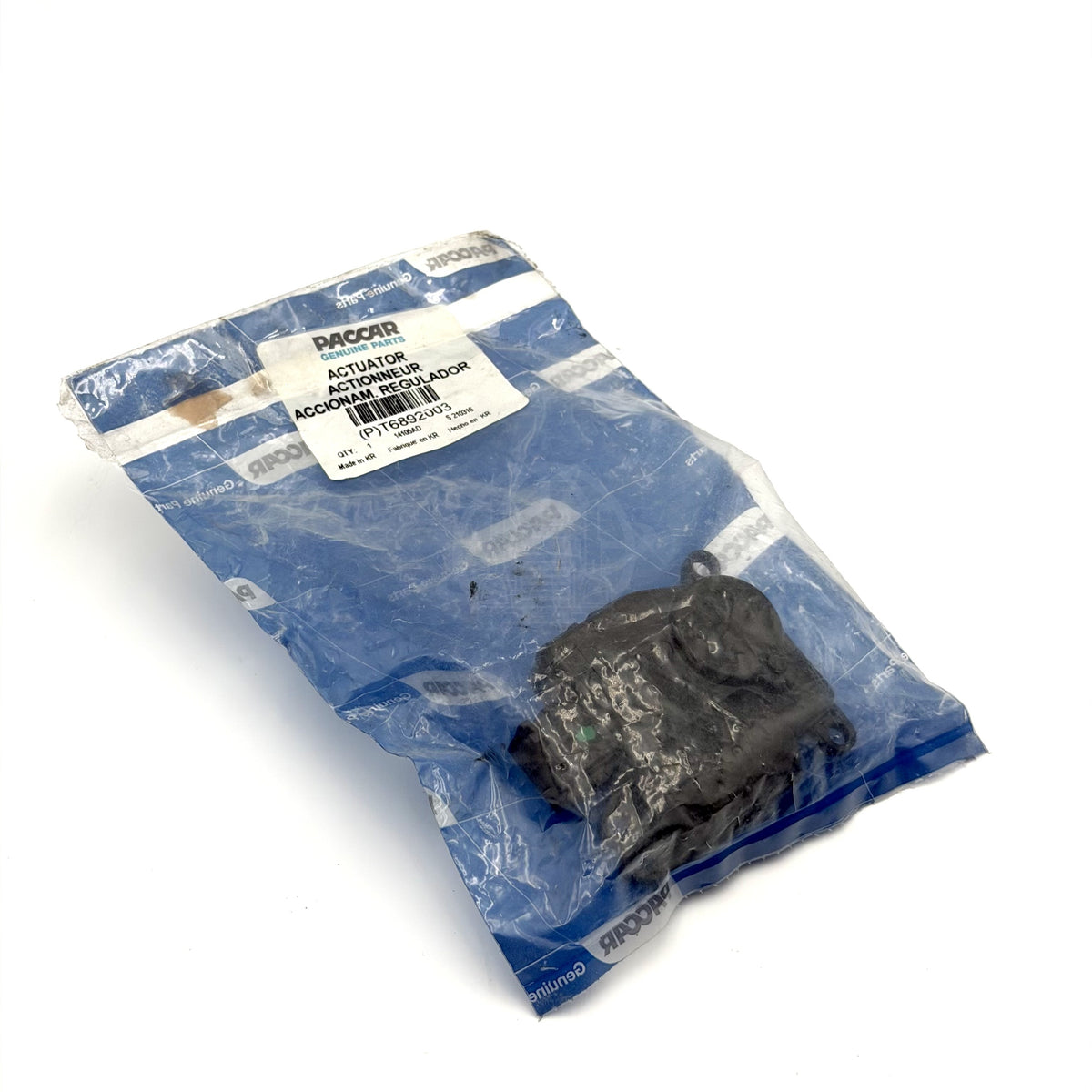 PACCAR T6892003 HVAC blend door actuator in its original factory plastic packaging.