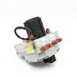 Front-angle view of the Wabco hydraulic valve brake modulator block (Part No. 8235-S4784070560) featuring a row of red protective caps on the fluid ports and a white remanufactured specification label.