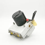 Rear top-down view of the 8235-S4784070560 assembly showcasing the top of the black cylindrical motor housing, locating pins, and yellow plastic caps on the underside ports.
