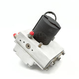 Alternating rear-angle shot of the 8235-S4784070560 unit detailing the metallic hex bolts, hydraulic fluid block interface, and top mounted components.