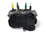 • Bottom view of the Volvo 85031447 pump housing, showing the molded plastic grid structure and mounting points.