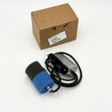 An angled overhead view of the electronic module connected via a braided cable to its dual-color foam filter element next to the shipping box, code 24191736.