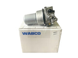 WABCO air dryer assembly (part number 24432421) showing the front ports and electrical connector, placed on its original box.